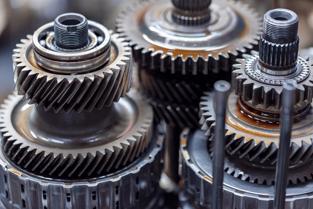 gear ration, Off-Road and Repair in Grand Junction, CO at Barney Brothers Off-Road and Repair. Close-up view of interconnected metallic transmission gears.