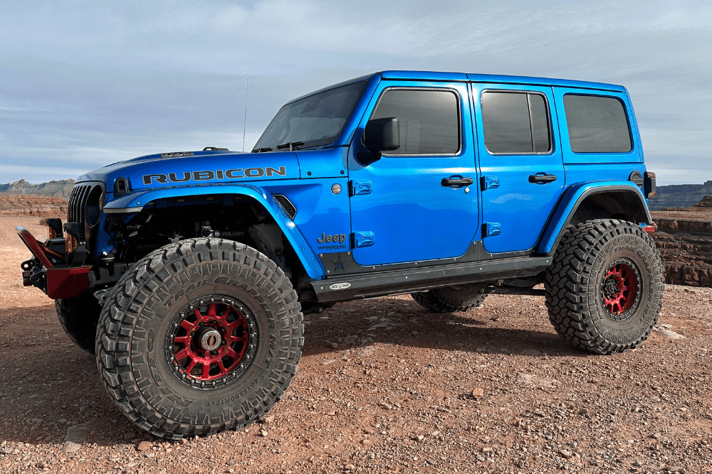 Off-road vehicle prep in Grand Junction, CO by Barney Brothers. Image of lifted Jeep Wrangler with beadlock wheels on desert trail.